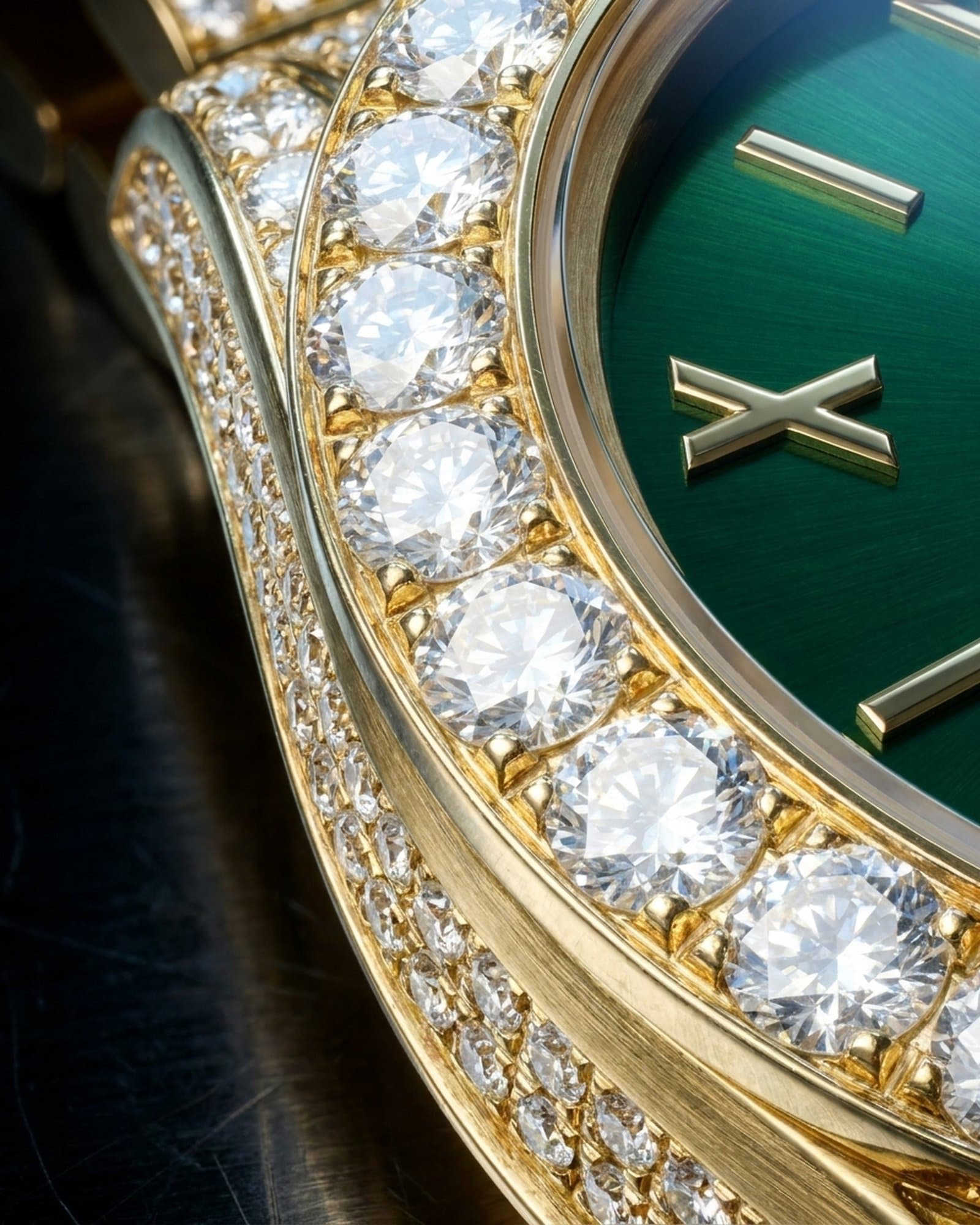 Close-up of the set gold bezel beside the green dial