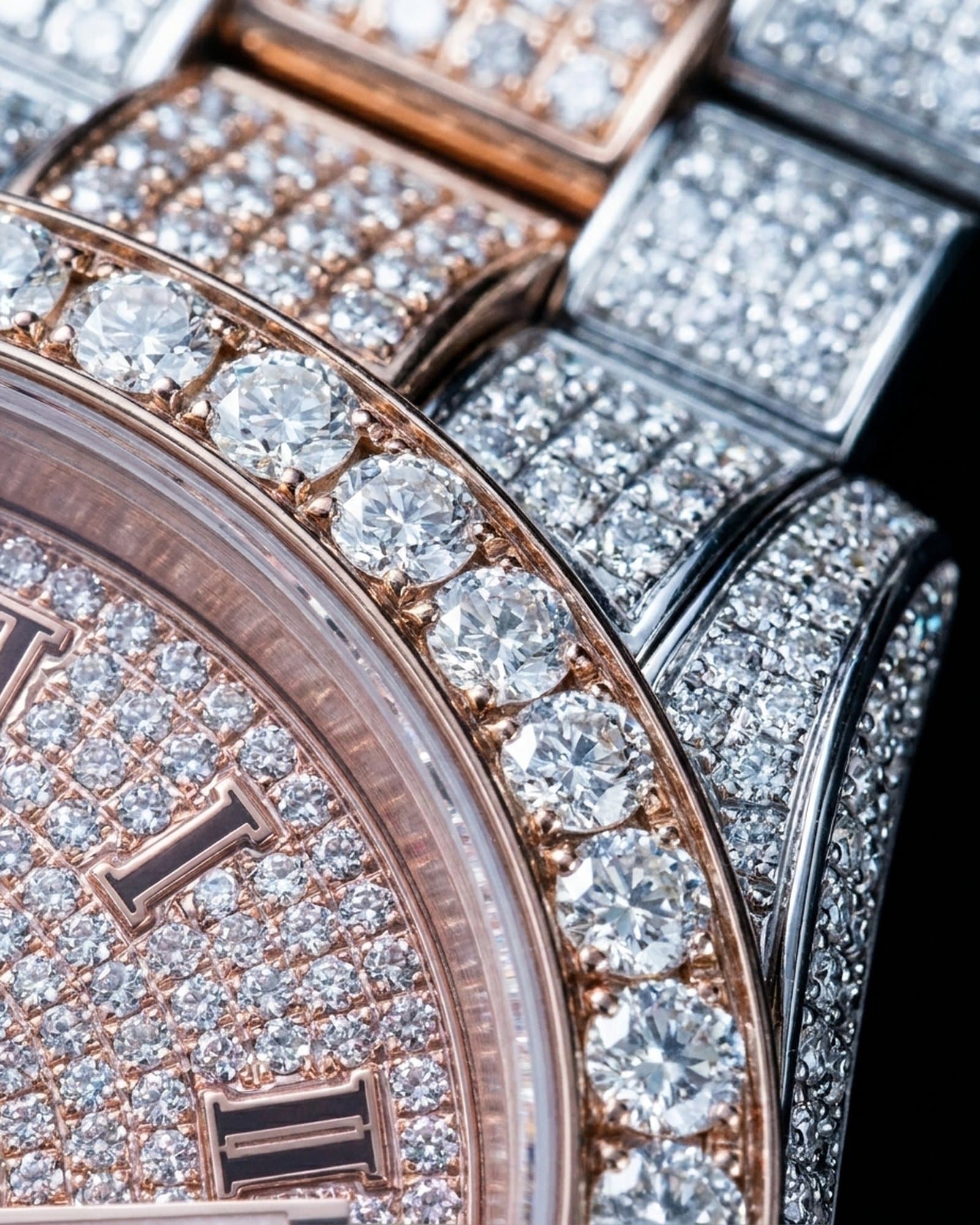 Close-up of the rose gold set bezel beside the pink pave dial