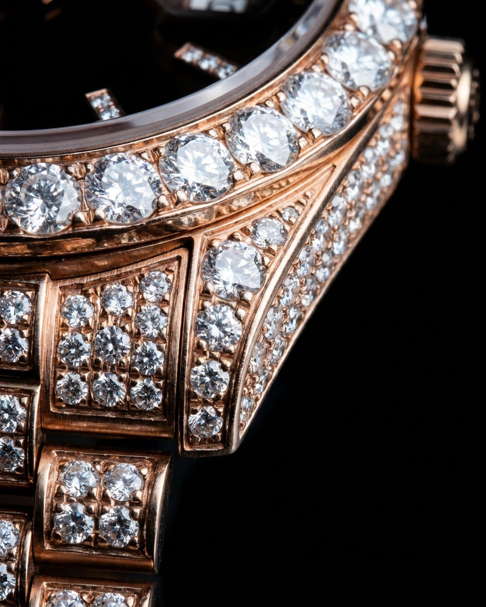 Close-up of the set rose gold bezel beside the brown dial